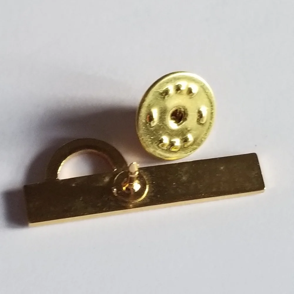 Mentor lapel pin Omega red enamel gold tone metal Greek symbol brooch